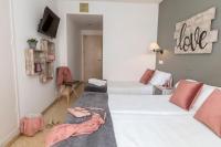 Postel nebo postele na pokoji v ubytování Hotel Bulevard