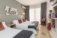 Postel nebo postele na pokoji v ubytování Hotel Bulevard