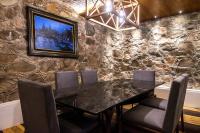 a dining room with a black table and chairs at Marsella 45 in Hermosillo