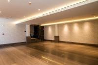 a large empty room with a wooden floor and white walls at Marsella 45 in Hermosillo