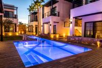 a swimming pool in front of a house at Marsella 45 in Hermosillo