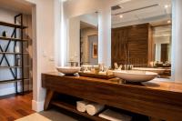 a bathroom with two sinks on a wooden counter at Marsella 45 in Hermosillo