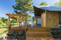a wooden deck with a gazebo at Kamp Romantik - glamping in Labin