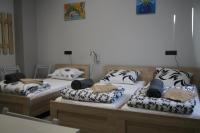 Łóżko lub łóżka w pokoju w obiekcie OLIVIA