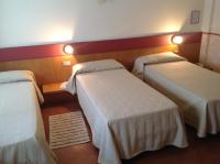 Posteľ alebo postele v izbe v ubytovaní Hotel Roma