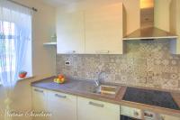 Kuchyň nebo kuchyňský kout v ubytování Apartman Maria