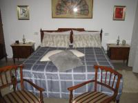 A bed or beds in a room at La casa tra i vigneti