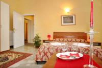 A bed or beds in a room at Argentiere Room Apartments