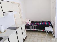 a small bedroom with a bed in the background at Studio-apartman Ella in Poreč