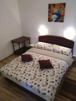 Posteľ alebo postele v izbe v ubytovaní Apartmani Sara i Marta