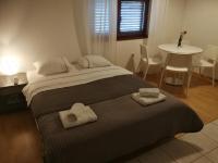 Posteľ alebo postele v izbe v ubytovaní Apartmani Sandra i Davor Lonic