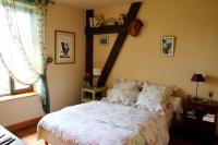 Una cama o camas en una habitaci&oacute;n de Chez Claire