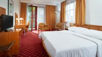 Postel nebo postele na pokoji v ubytování OREA Spa Hotel Cristal