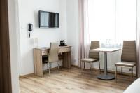 Televízia a/alebo spoločenská miestnosť v ubytovaní Janda Resort & Conference