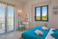 Postel nebo postele na pokoji v ubytování Nefeli Villas