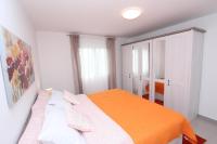 Posteľ alebo postele v izbe v ubytovaní Apartment Sorriso 2