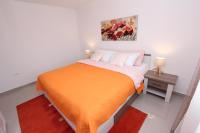 Posteľ alebo postele v izbe v ubytovaní Apartment Sorriso 2