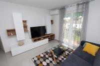Televízia a/alebo spoločenská miestnosť v ubytovaní Apartment Sorriso 2