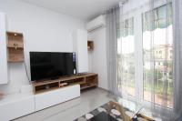 Televízia a/alebo spoločenská miestnosť v ubytovaní Apartment Sorriso 2