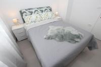 Posteľ alebo postele v izbe v ubytovaní Apartment Sorriso 2