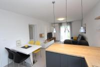 Televízia a/alebo spoločenská miestnosť v ubytovaní Apartment Sorriso 2