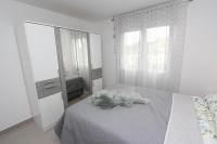 Posteľ alebo postele v izbe v ubytovaní Apartment Sorriso 2