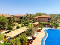 an aerial view of a resort with a swimming pool at Seafront Residences in Bijilo
