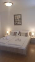 Posteľ alebo postele v izbe v ubytovaní Apartments Corner