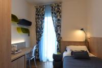 A bed or beds in a room at Hotel La Vigna