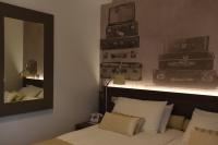 A bed or beds in a room at Hotel La Vigna