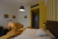 A bed or beds in a room at Hotel La Vigna