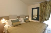 A bed or beds in a room at Hotel La Vigna