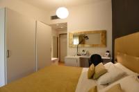 A bed or beds in a room at Hotel La Vigna