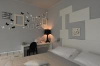 A bed or beds in a room at Hotel La Vigna
