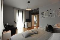 A bed or beds in a room at Hotel La Vigna