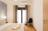 Postel nebo postele na pokoji v ubytování Nicholas Point Apartments and Rooms