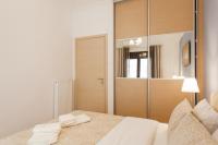 Postel nebo postele na pokoji v ubytování Nicholas Point Apartments and Rooms