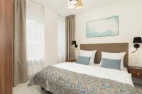 Ein Bett oder Betten in einem Zimmer der Unterkunft Aquamarina Onyx Marina Invest