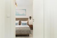 Ein Bett oder Betten in einem Zimmer der Unterkunft Aquamarina Onyx Marina Invest