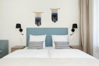 Ein Bett oder Betten in einem Zimmer der Unterkunft Aquamarina Onyx Marina Invest