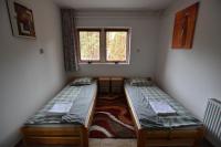 Łóżko lub łóżka w pokoju w obiekcie Borsi Apartman