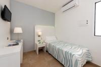 Postel nebo postele na pokoji v ubytování Hostal Pitiusa