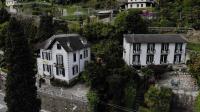 an aerial view of a house and a mansion at Hotel Villa Ruscello in Baveno