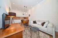 Televízia a/alebo spoločenská miestnosť v ubytovaní Center Simeon apartment