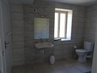 a bathroom with a sink and a toilet at LA COURTEILLE in Saint-Fraimbault-sur-Pisse