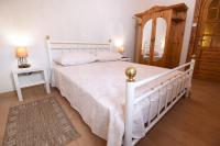 Posteľ alebo postele v izbe v ubytovaní House & Apartment Palača
