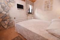 Posteľ alebo postele v izbe v ubytovaní House & Apartment Palača