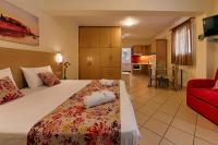 Postel nebo postele na pokoji v ubytování Angelica Hotel