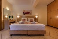 Postel nebo postele na pokoji v ubytování Angelica Hotel