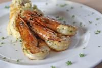 a plate of food with shrimp and mashed potatoes at Novotel Panama City in Panama City